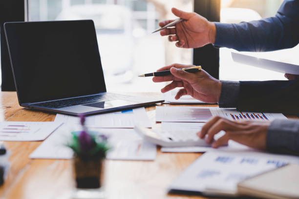 istock Business teamwork process, businessman advisor, two business people talking, planning analyze investment report and marketing on a laptop in the office, Market analysis 1639620103