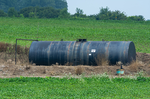 Crude oil machine pumping oil in the fields of Ontario, Canada.