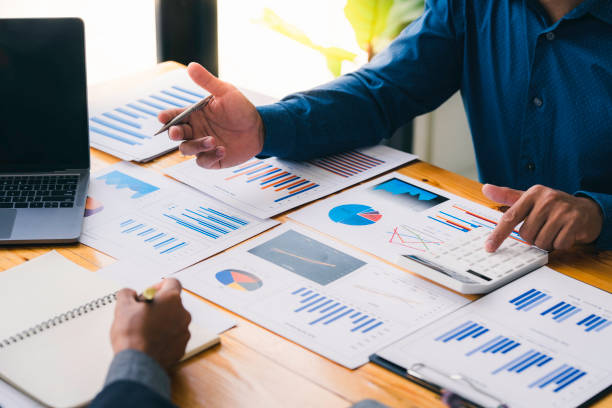 istock Business people meeting at office, teamwork process. reports professional crew working with new startup project. Analyze business plans laptop two business people talking, Market analysis 1639637437