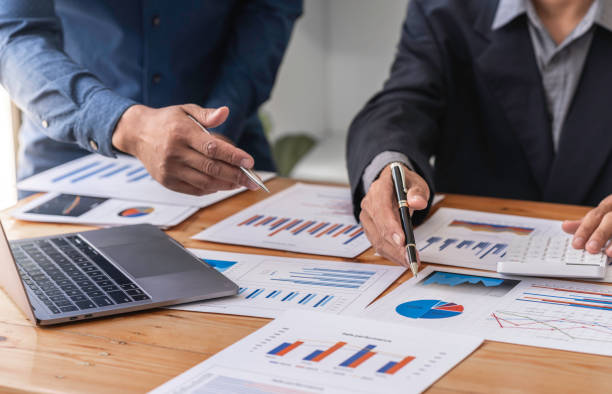 istock Business teamwork process, businessman advisor, two business people talking, planning analyze investment report and marketing on a laptop in the office, Market analysis 1639638557