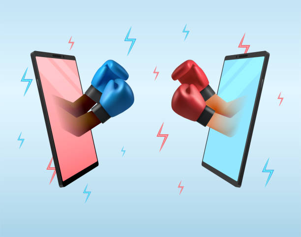 istock The concept of remote quarrel via the internet using their phones. Hands in boxing gloves. 1639698065