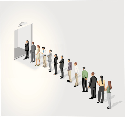 Business people standing in a line in front of a elevator / lift door.