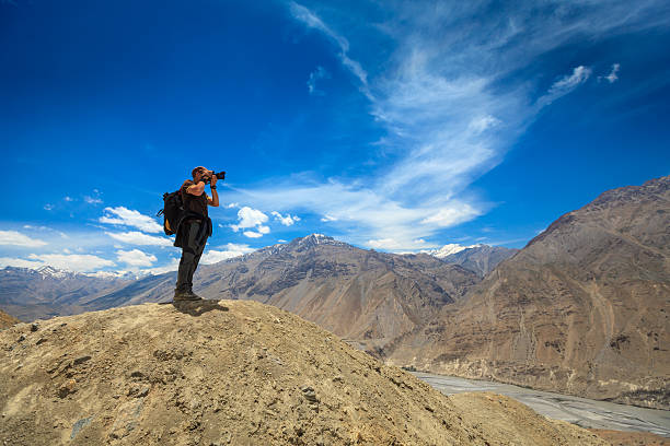 istock Photographer taking photos in Himalayas 163970279