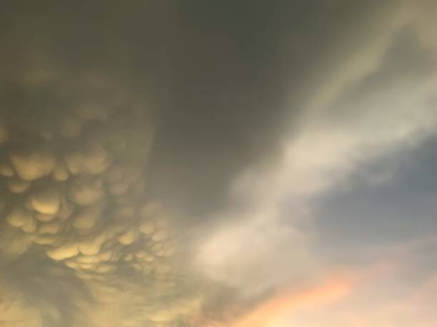 istock Beautiful Fluffy clouds in the blue sky on the evening before sunset 1639711790