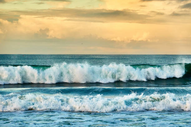 istock Scenic view of beach against dramatic sky during sunrise 1639733651