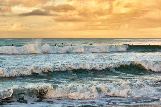 istock Scenic view of beach against dramatic sky during sunrise 1639733656