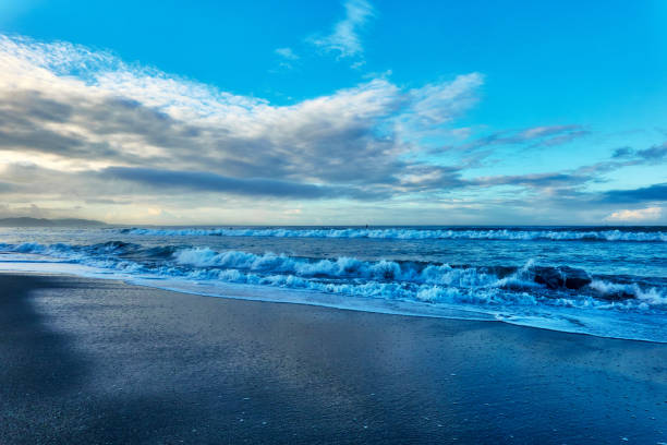istock Scenic view of beach against blue sky during sunrise 1639734184