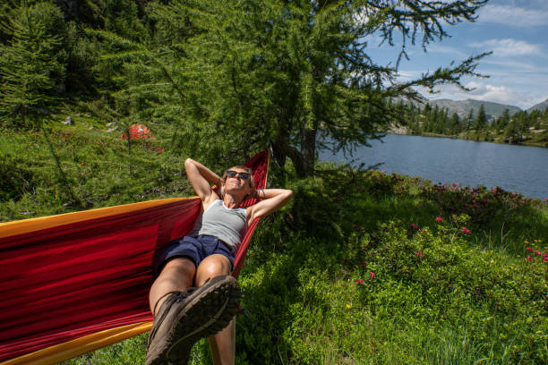 istock Female hiker relaxer on hammock in nature 1639734740
