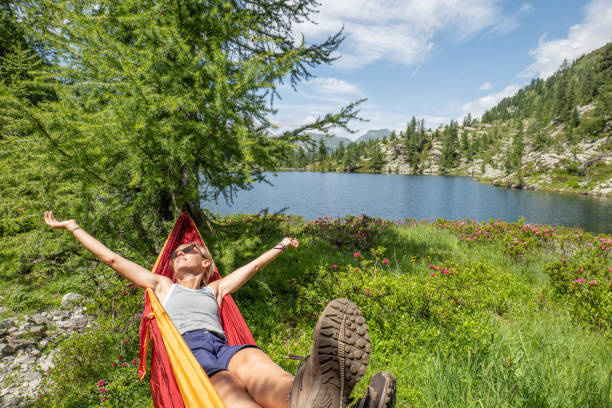 istock Female hiker relaxer on hammock in nature 1639734748
