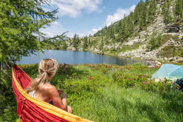 istock Female hiker relaxer on hammock in nature 1639735268