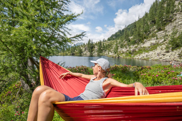 istock Female hiker relaxer on hammock in nature 1639735282