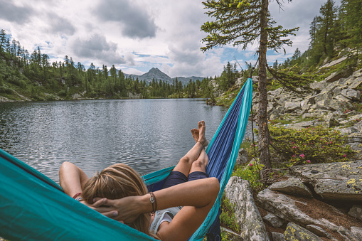 Woman on hammock by the lake