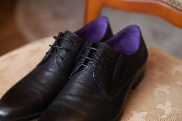 Black shoes on a chair. Wedding day.