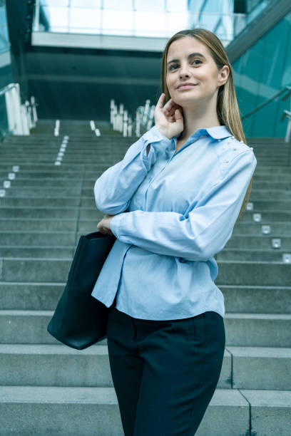istock Young business woman with bag 1639769124