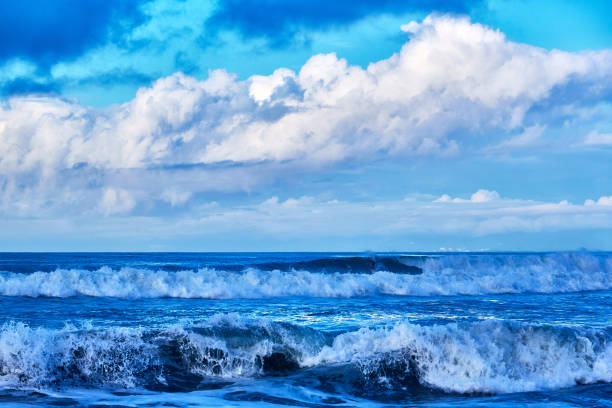 istock Scenic view of beach against dramtic sky during sunrise 1639781865
