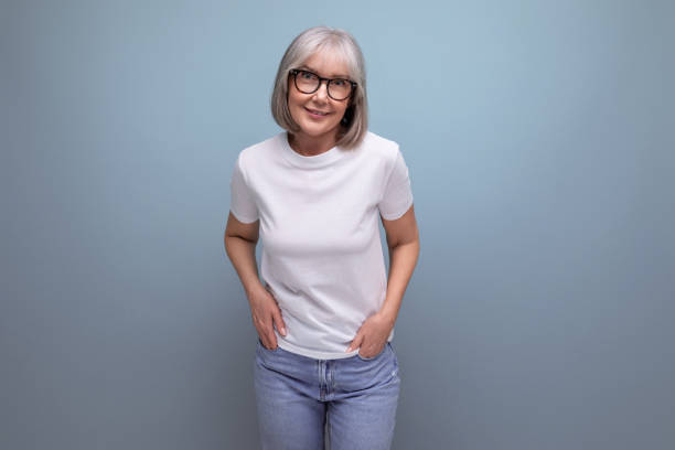 istock charming 60s woman in white tank top on studio background 1639788794