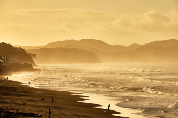 istock Scenic view of beach against dramatic sky during sunrise 1639800545