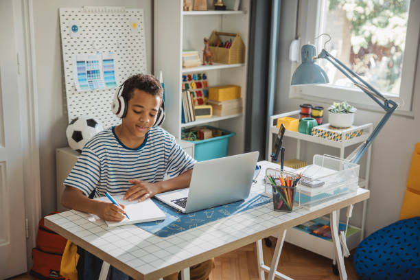 istock Teenage boy studding at home 1639819437