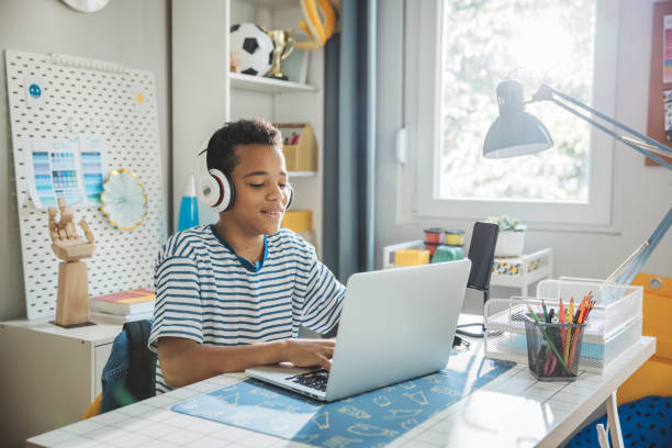 istock Teenage boy studding at home 1639819952