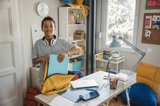 istock Teenage boy studding at home 1639820480