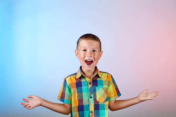 istock Artistic cheerful child on a gradient color background 1639822077