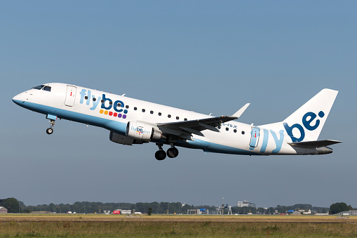 Vijfhuizen, Netherlands - June 28, 2019: British flybe Embraer ERJ-175 with registration G-FBJE taking off runway 36L (Polderbaan) of Amsterdam Airport Schiphol.