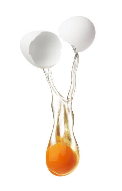 istock Egg yolk and white dropping out of cracked shell 1639836974