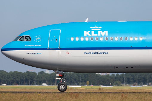 Vijfhuizen, Netherlands - June 28, 2019: Dutch KLM Airbus A330-300 with registration PH-AKA on take off roll on runway 36L (Polderbaan) of Amsterdam Airport Schiphol.