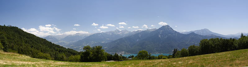 Distant view of the Inn River valley across a lush Austrian Alps meadow close to Mösern.