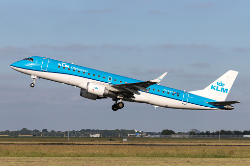 Vijfhuizen, Netherlands - June 27, 2019: Dutch KLM Cityhopper Embraer ERJ-190 with registration PH-EXY taking off runway 36L (Polderbaan) of Amsterdam Airport Schiphol.
