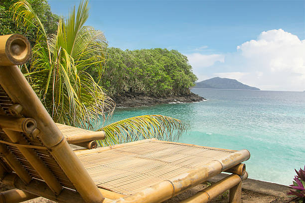 istock Bamboo chair on a beach 163985556