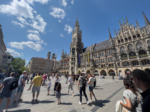 The Frauenkirche (German: Dom zu Unserer Lieben, Eng: Cathedral of Our Dear Lady ) was photographed on 11th June 2023, during pride month in the town center of München