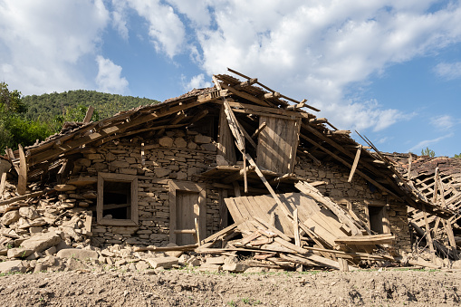 Old abandoned broken rural houses.