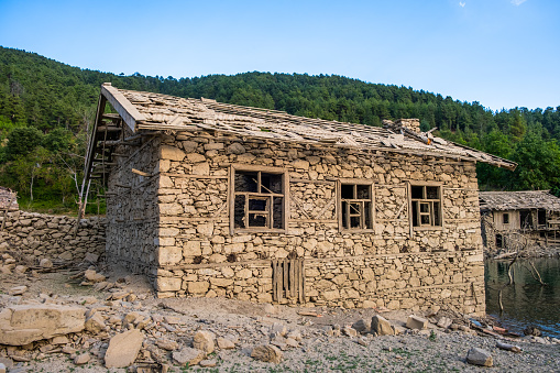 Old abandoned broken rural houses.