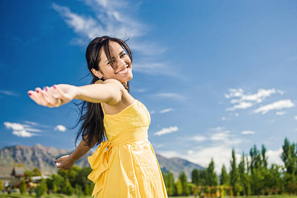 istock Carefree Girl Twirling Around 163991747