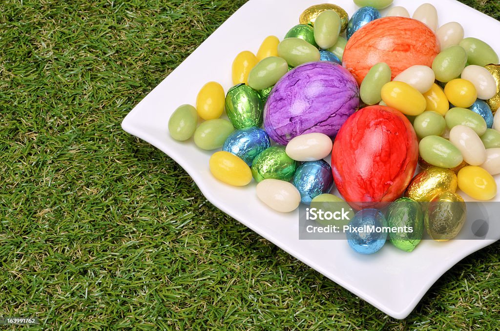 Easter decoration on grass Easter eggs on a plate Blue Stock Photo