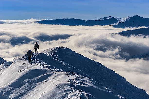 istock climbing the mountain in winter 163991874