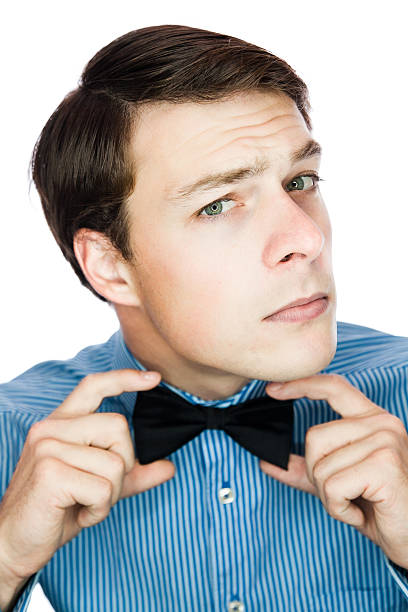 istock Handsome old-fashioned gentleman adjusting his bow tie 163992147
