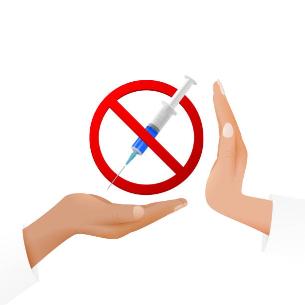 istock Vaccination or drugs refusal concept. A syringe on the hand in a prohibitory sign and a hand expressing protest. 1639930178