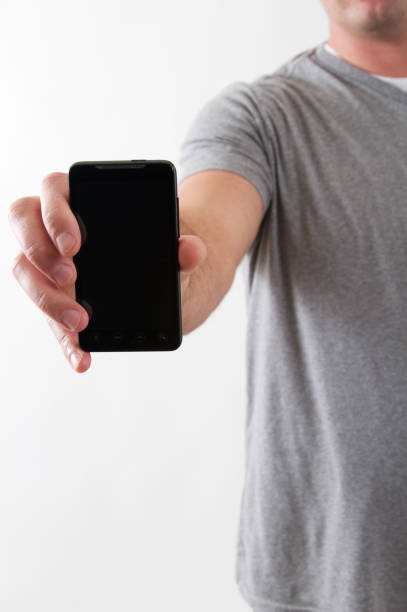 istock Man Holding his Smartphone 163995494