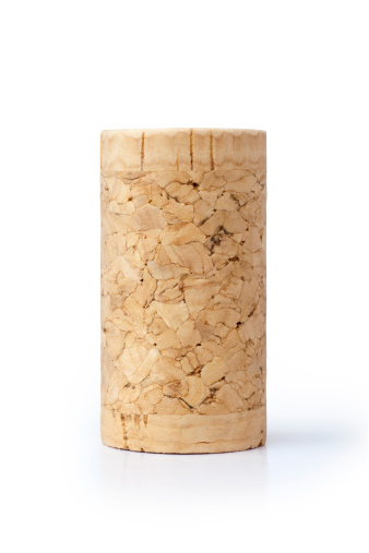 Close-up corkscrew with a cork. dark background