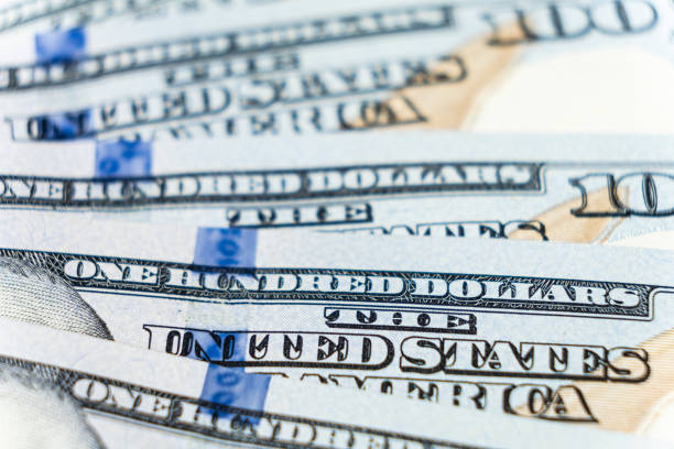 istock A lot of 100 dollar bills close-up macro. 1639977876