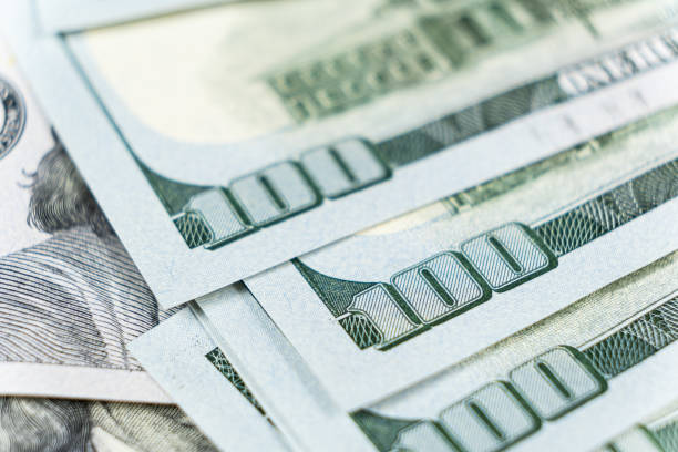 istock A lot of 100 dollar bills close-up macro. 1639978403