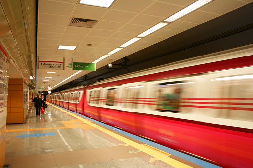 De, India – December 01, 2022: A long exposure shot of a modern train arriving at the station, Delhi Metro, India