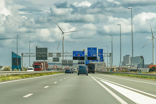 Dutch motorway near Amsterdam with wind turbines