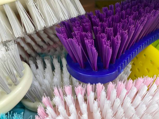 istock Colourful Scrub brush isolated on shelf 1639998782