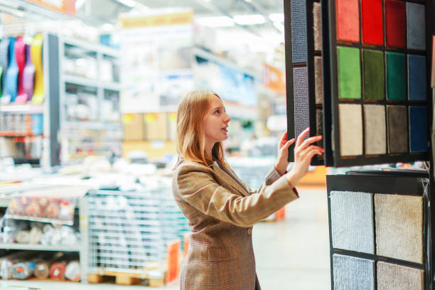 istock woman chooses a carpet in a hardware store 1640018758