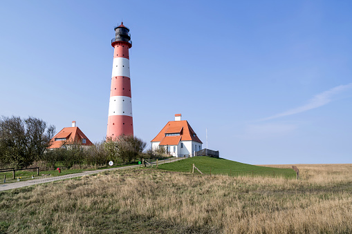 The lighthouse was built in 1912 and 1913 as a cross mark light in front of a sandbank at the entrance to Lister Tief to have an addition to the main light (Kampen).