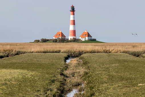 Westerheversand lighthouse in Schleswig-Holstein, Germany. Considered to be one of the best-known lighthouses in northern Germany, it was built in 1908.