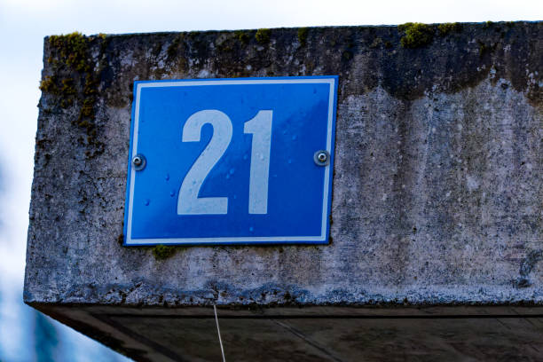 istock Blue metal plate with white number 21. 1640027389
